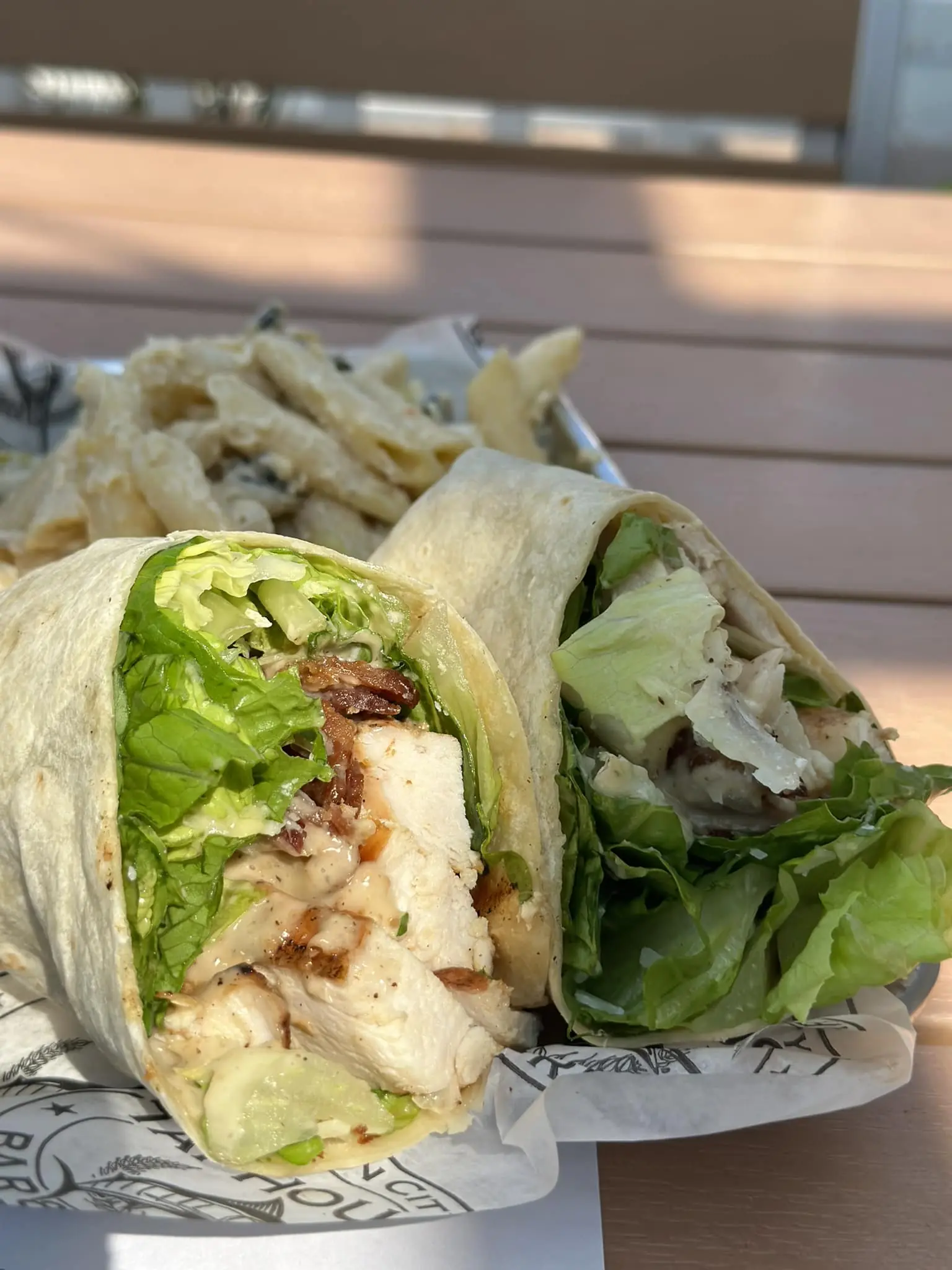 a wrap with lettuce and chicken on it